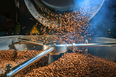 Visible Conveying of Freshly Roasted Beans Creates Unique Customer Experience at Merlo Coffee