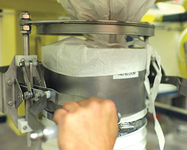 Norwegian Confectionery Maker Improves Safety, Stops Dust, Discharges Bulk Bags Automatically