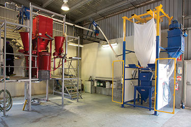 Seed Processor Contains Dust with Bulk Bag Discharger, Flexible Screw Conveyors