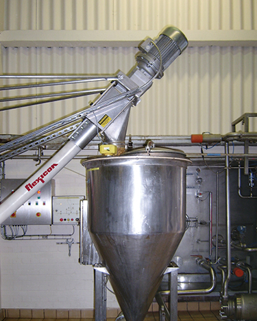 Dust-Tight Bulk Bag Discharger with Flexible Screw Conveyor Eliminates Waste, Improves Safety and Quality